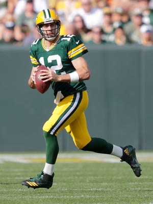 Green Bay Packers quarterback Aaron Rodgers (12) looks to pass against the Cincinnati Bengals Sunday, September 24, 2017, at Lambeau Field in Green Bay, Wis.