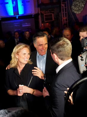 Mitt Romney, center, greets supporters with his wife Ann at a dinner during the Republican National Committee's annual winter meeting in San Diego on Jan. 17.