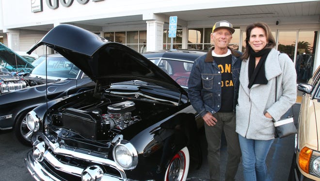Greg Benoit and Carol Malamud pose with Greg's 1951 Ford at the Donut Derelicts car show  in Huntington Beach, Calif.