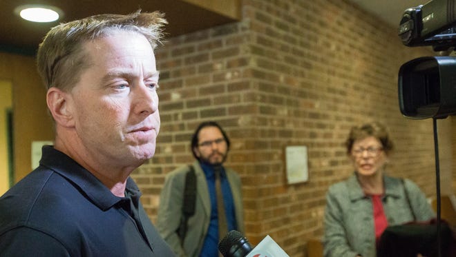 Ross Flynn, speaks to the media on Thursday, April 7, 2016, in 3rd Judicial District Court after the jury found him not guilty of aggravated assault and assault on an officer. He was convicted on a charge of evading arrest. Looking on in the background is Flynn's associate attorney Chris Cardenas, left, and his mother Mary Ann Flynn.