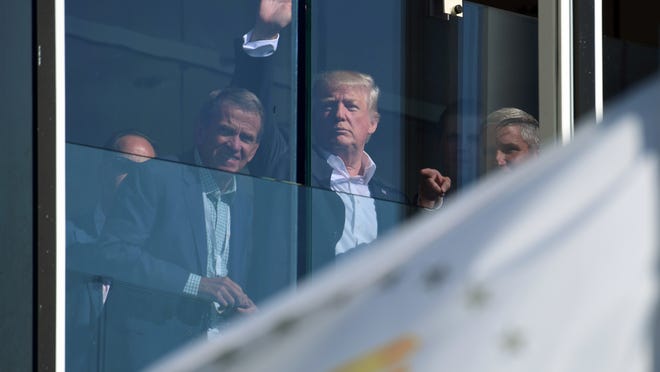 President Donald Trump watches the Presidents Cup golf tournament in Jersey City, N.J., Sunday, Oct. 1, 2017. The President of the United States is the Honorary Presidents Cup Chairman. (AP Photo/Susan Walsh)