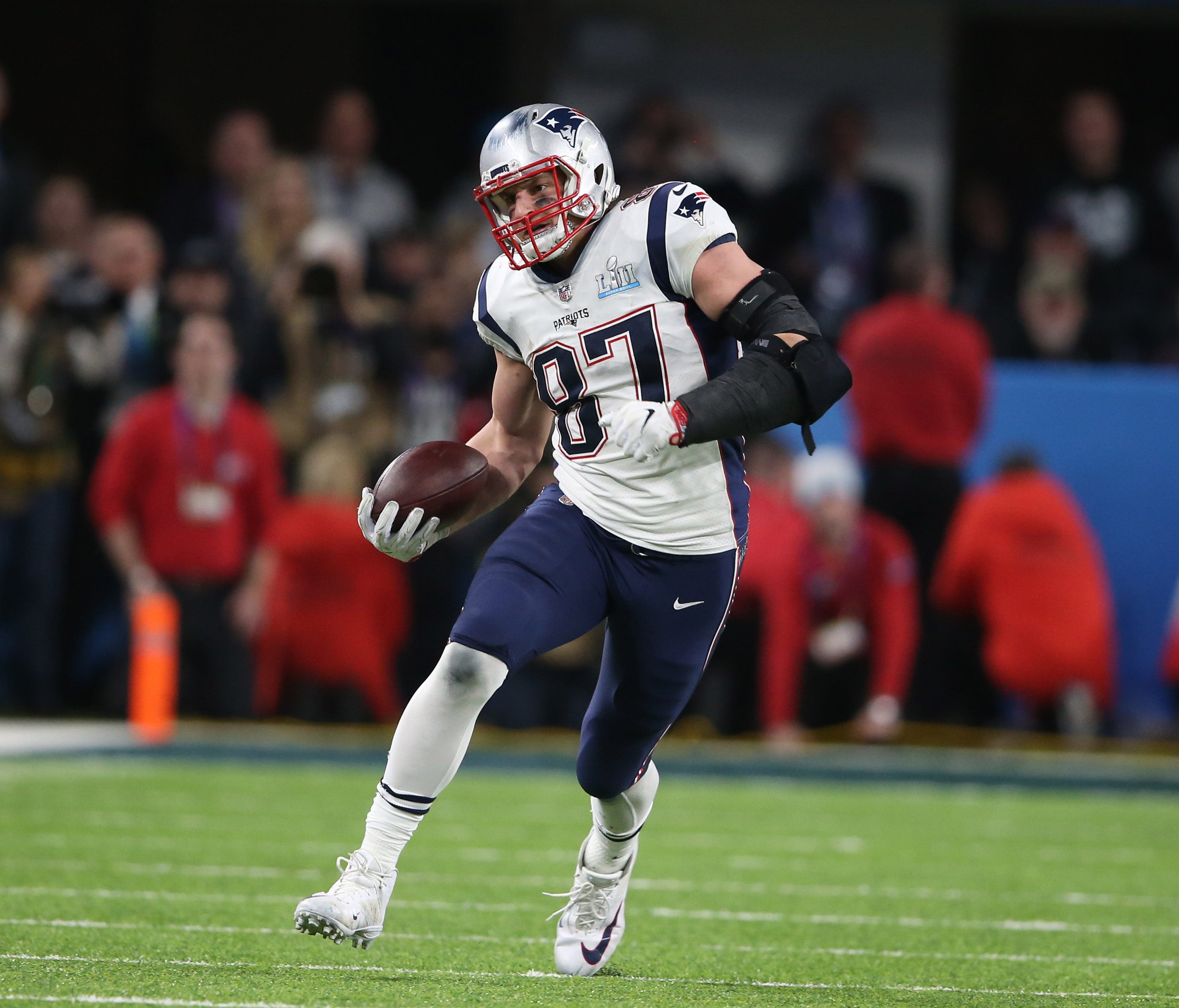 New England Patriots tight end Rob Gronkowski (87) runs the ball after a catch against the Philadelphia Eagles during the fourth quarter in Super Bowl LII at U.S. Bank Stadium.