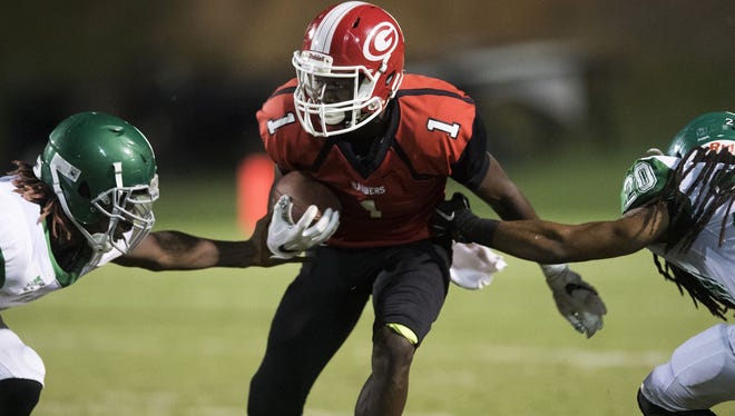 Senior wide receiver Ty Hellams (1) and the Greenville Red Raiders are No. 8 in Class AAAA heading into their game No. 7 Greer Friday at Dooley Field.