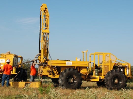 The off-road vehicles are typical of equipment used in upland areas during seismic testing.