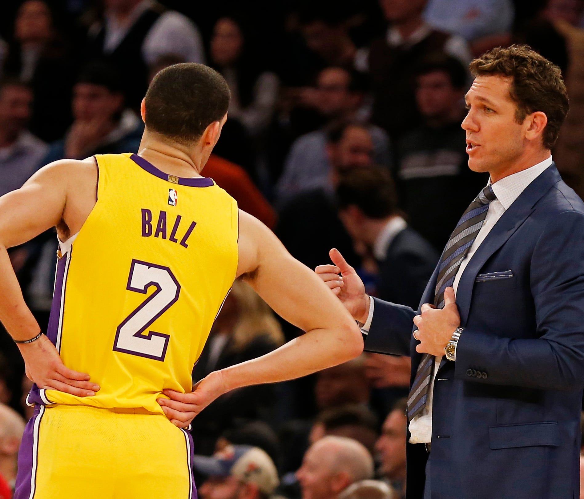 Los Angeles Lakers head coach Luke Walton talks to Lakers guard Lonzo Ball (2) during overtime against the New York Knicks at Madison Square Garden.