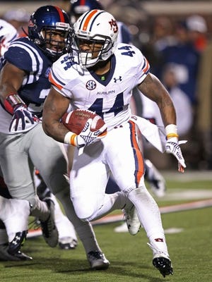 Nov 1, 2014; Oxford, MS, USA; Auburn Tigers running back Cameron Artis-Payne (44) rushes against the Ole Miss Rebels during the fourth quarter at Vaught-Hemingway Stadium. Auburn defeated Ole Miss 35-31. Mandatory Credit: Nelson Chenault-USA TODAY Sports