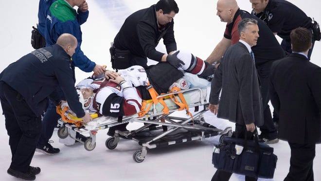 Arizona Coyotes right wing Brad Richardson (15) is taken off the ice after being injured during the game against the Vancouver Canucks on Thursday, Nov. 17, 2016, in Vancouver, British Columbia.