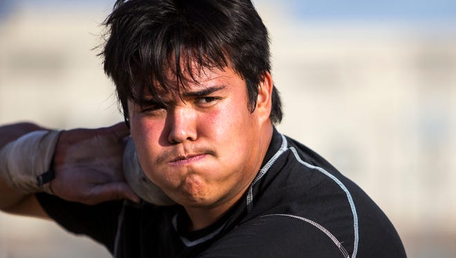 Desert Edge's Tyson Jones practices shot put on Tuesday, Feb. 13, 2018 at Desert Edge High School in Goodyear, Ariz. Jones, who has committed to Virginia Tech, is one of the best high school shot put athletes in the country.