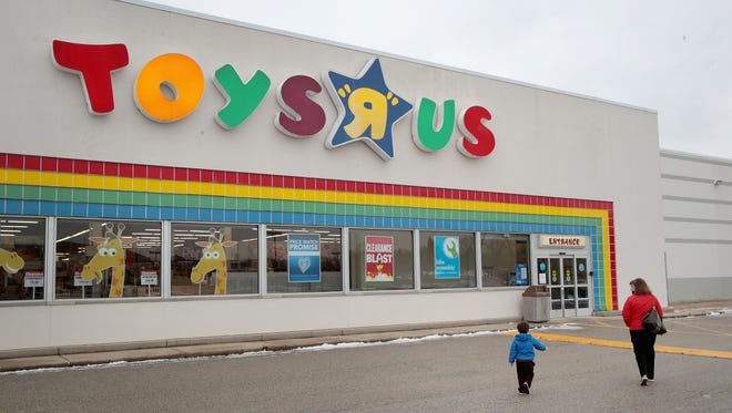 Customers shop at a Toys "R" Us store on Jan. 24, 2018 in Highland Park, Ill. The store is one of more than 180 Toys "R" Us and Babies "R" Us stores scheduled to close. The closings involve about one-fifth of the company's Toys "R" Us and Babies "R" Us U.S. store fleet. The company recently filed for bankruptcy protection.  
