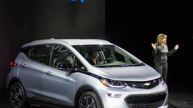 Automakers are responding to the push to cut carbon emissions with not-yet-profitable alt-energy vehicles such as Chevrolet’s Bolt.