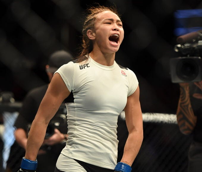 Michelle Waterson (blue gloves) during UFC Fight Night at Golden 1 Center.