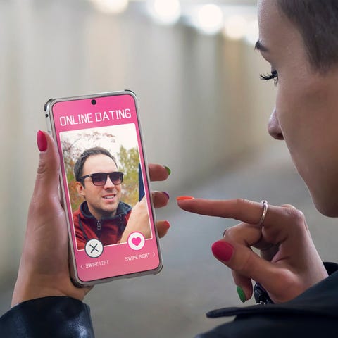 A person using a dating app on a smartphone.