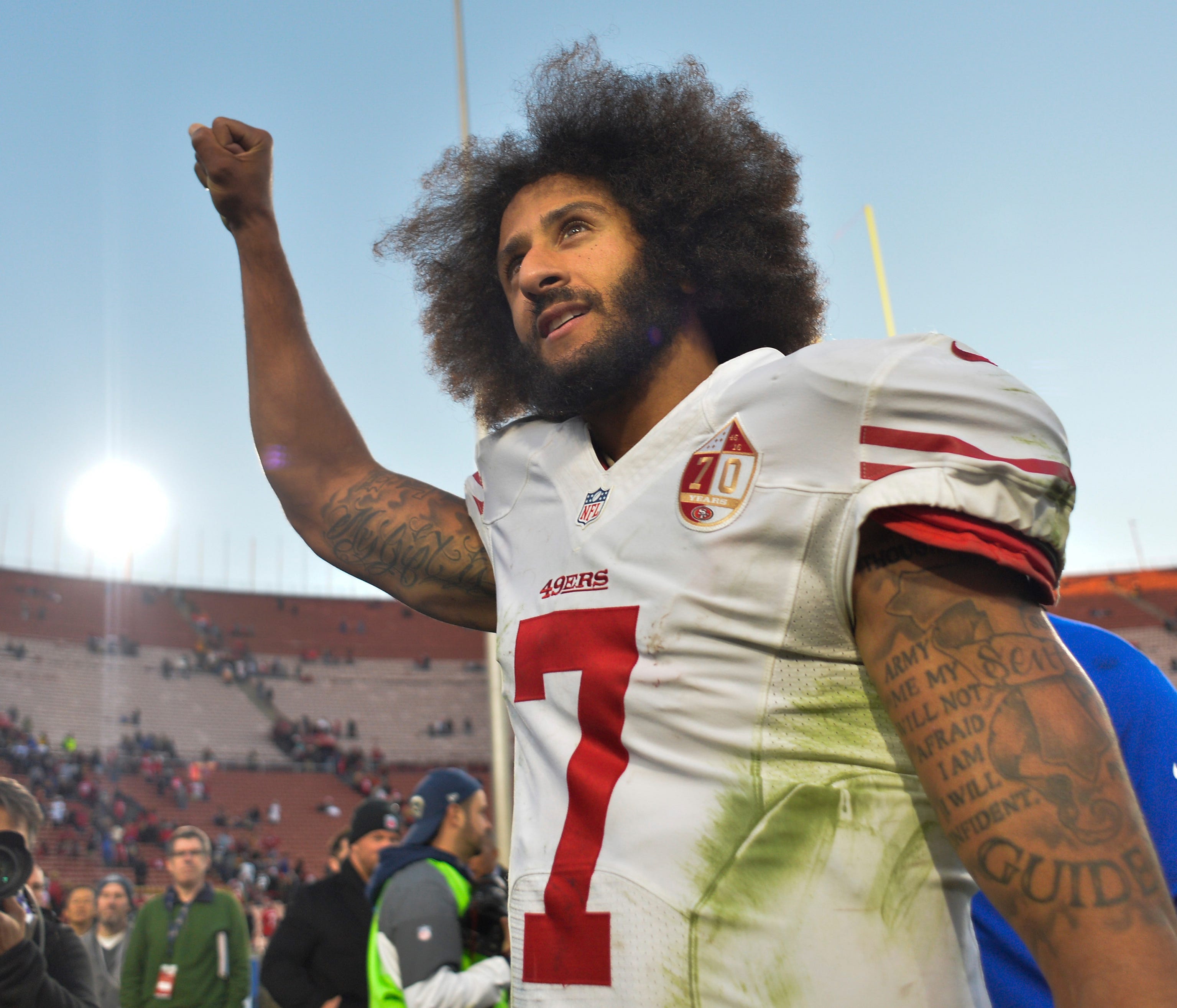 Dec 24, 2016; Los Angeles, CA, USA; San Francisco 49ers quarterback Colin Kaepernick (7) pumps his fist as he acknowledges the cheers from the 49ers' fans after leading his team to a 22-21 come-from-behind win over the Los Angeles Rams at Los Angeles