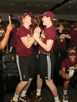 ASU's Kelsey Moos, left, and Sophie Brunner celebrate with their teammates after they learned their team is a school best No. 2 seed in the NCAA Tournament.