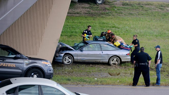 Emergency crews on scene at an accident Monday in the I-229 median under the Solberg Avenue Overpass.