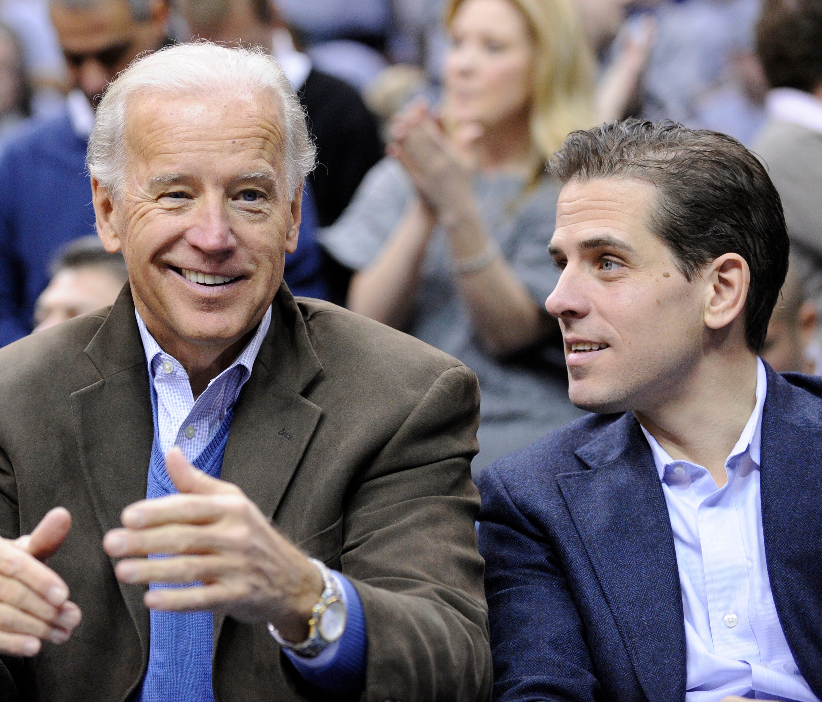 In this Jan. 30, 2010, file photo, Vice President Joe Biden and his son Hunter attend the Duke-Georgetown NCAA basketball game in Washington.