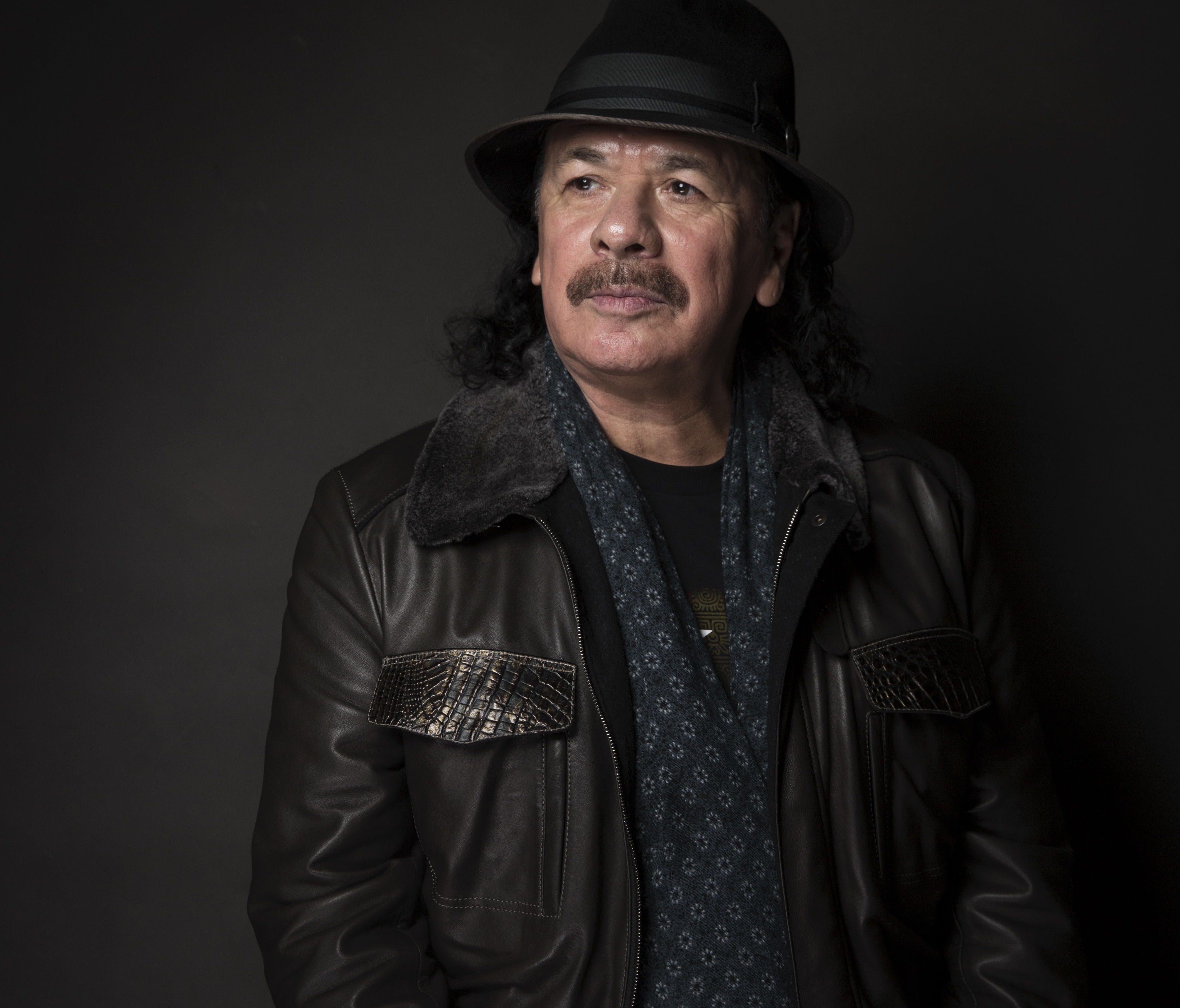 Carlos Santana is clarifying comments he made about Adele and Beyonce.