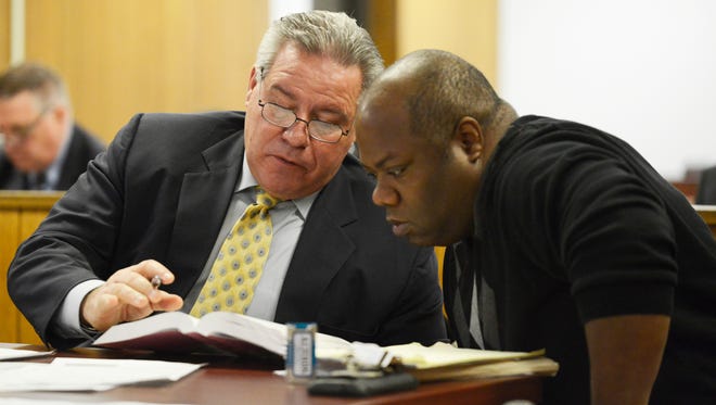 Prosecutor Andrew M. Cimiluca speaks with Teaneck resident Elie Jones in Hackensack Superior Court on Feb. 23, 2017. Jones filed numerous criminal complaints against township employees including Teaneck Police Officer Joseph Careccio, Lt. Thomas Tully, Andrew Gold and Issa Abbasi.