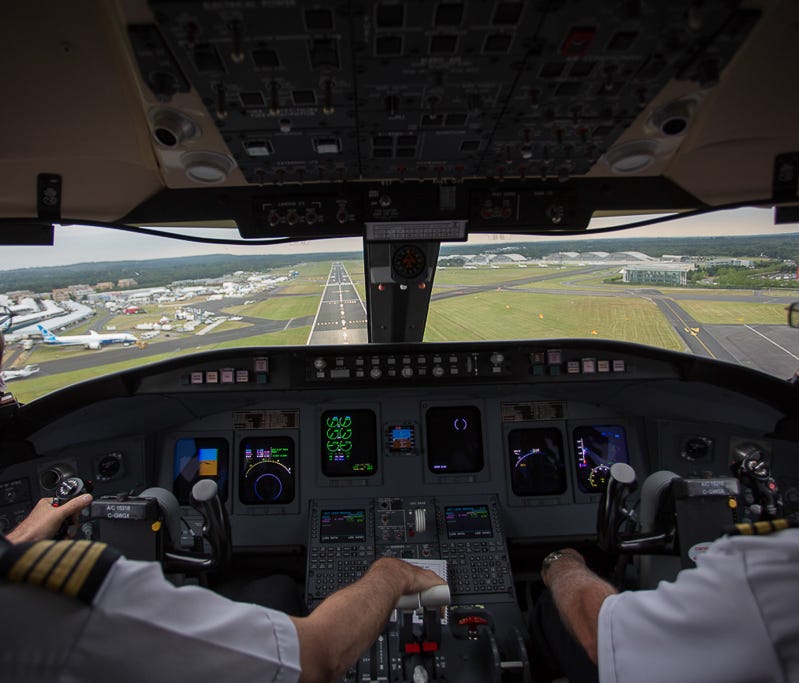 Operating for Bombardier, a company CRJ-900 lands at the 2014 Farnborough Airshow in the England on July 11, 2014.