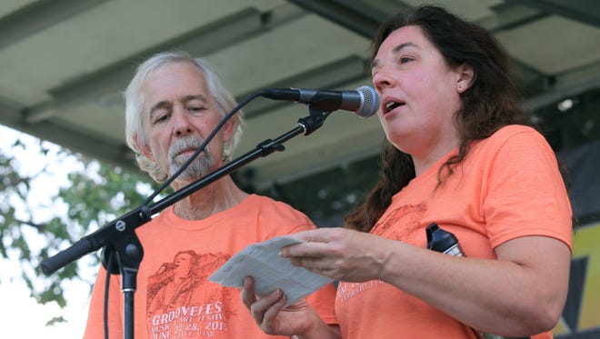 Tim and Lisa Cretsinger make announcements at the 2015 Groovefest Music and Art Festival in Cedar City. Tim only spoke briefly during the festival due to complications from thoat cancer.