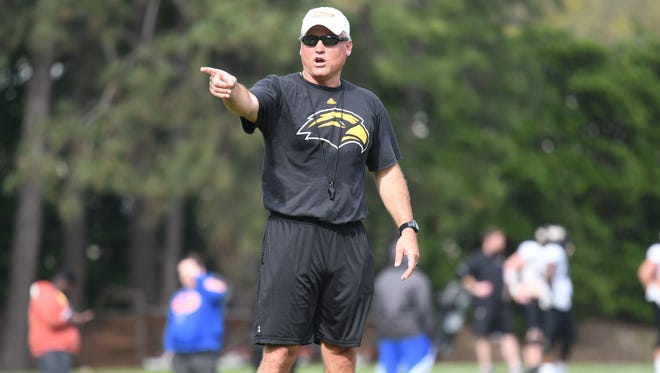 Southern Miss football coach Jay Hopson gestures during Tuesday's spring training practice.