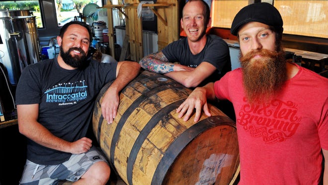 John Curtis and Kyle Smyth, center, own and manage Intracoastal Brewing Co. in of Melbourne. Donald Atwell, right, is brewmaster.