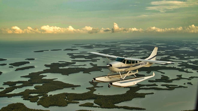 Salt Island Seaplane’s Cessna 206 flies over the Ten Thousand Islands, near Everglades City.