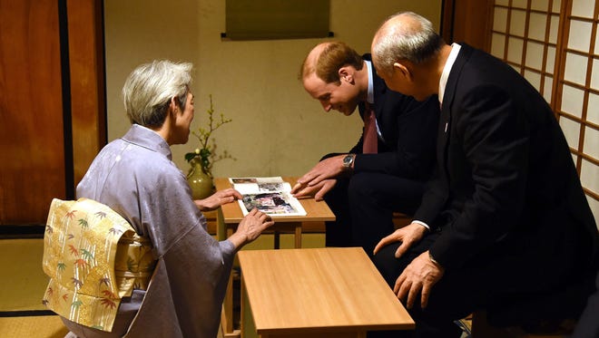 Prince William is served Japanese tea at a restored Tea House at Hama Rikyu gardens in Tokyo.