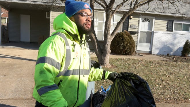 Republic Services driver Barry Bowman collects post-Christmas recyclables in the Fireside neighborhood in York City Tuesday, Dec. 26, 2017. He said Dec. 26 is one of the busiest days of the year. Bill Kalina photo