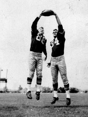 Green Bay Packers ends Billy Howton, left, and Gary Knafelc, who posed for this photo in early August 1957, scored key touchdowns in the team's first game at new City Stadium about six weeks later.