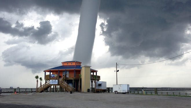 A waterspout spins on June 19, 2013, on Grand Isle, La.