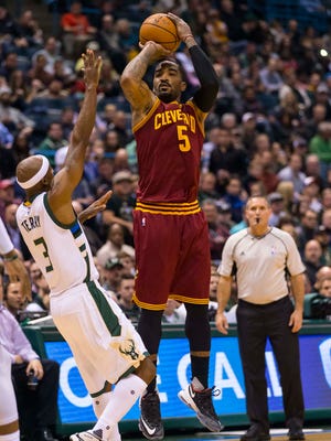 Cleveland Cavaliers guard J.R. Smith (5) shoots during the first quarter against the Milwaukee Bucks at BMO Harris Bradley Center.