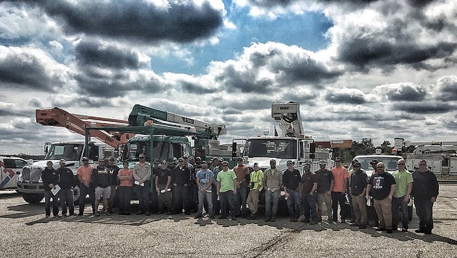 Jake Zipperer, a Manitowoc Public Utilities line mechanic, teamed up with a lineman from New Holstein and 39 other crew members from communities representing the Municipal Electric Utilities of Wisconsin in responding to Hurricane Irma in Florida. Pictured is the Municipal Electric Utilities of Wisconsin crew in Florida.