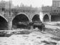 A train running on tracks in the dry Genesee River