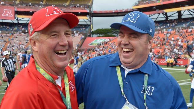 AFC coach John Fox, left, and NFC coach Mike McCarthy shake hands after the 2013 Pro Bowl.