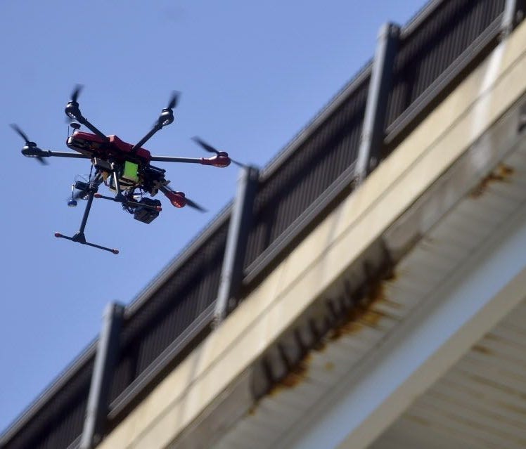 An Align M690L drone flies Aug. 23, 2016, along the northbound side of the Gold Star Bridge to photograph and record video for bridge inspection in Connecticut.
