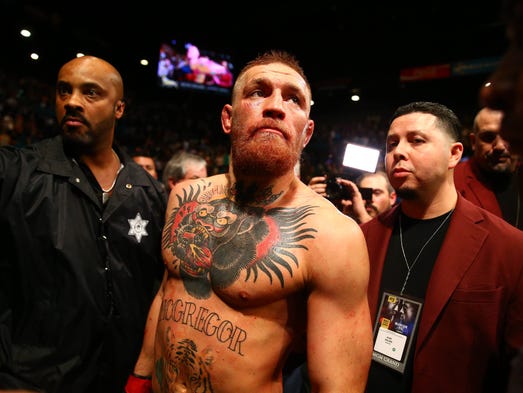 Conor McGregor reacts following his loss against Nate