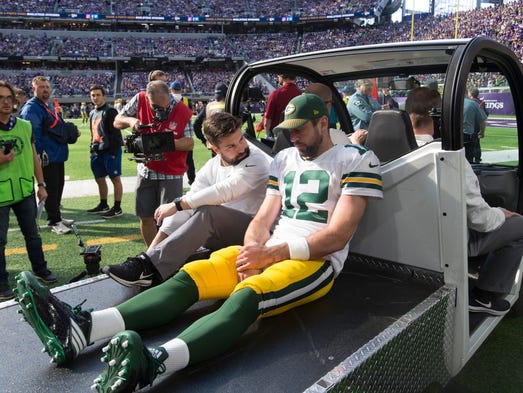 Aaron Rodgers is driven off the field on a cart Oct.