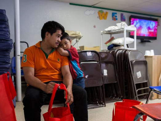 McAllen, TX, U.S.A . Genin Rodas, 29, and son is Edison