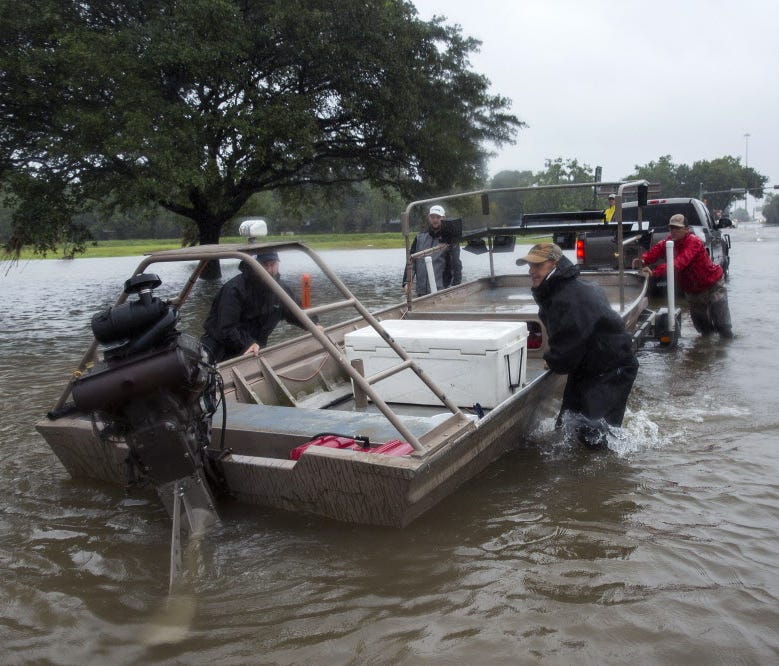 Volunteer search and rescuers from Passion Pursuit film production company launch their motor boat near Bray Bayou and Loop 610 to rescue flood victims in the Meyerland neighborhood  after Hurricane Harvey inundated the area Aug. 28, 2017, in Houston