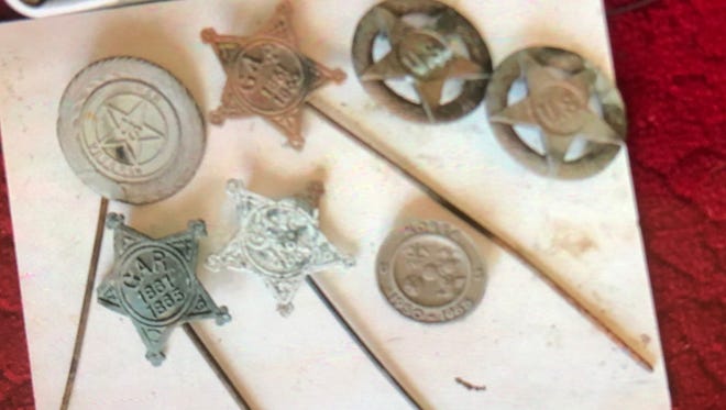 Military grave marks, some dating back to 1865, were found by Bob Wess.