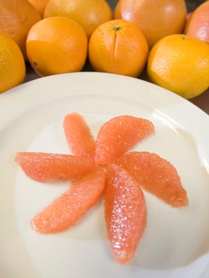 A step by step on how to slice grapefruit sections.
