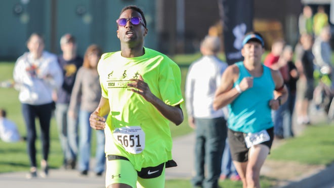 Morcelli Kombo (No. 5651) runs on his way to winning the Earth Day 5K title in 2017. Kombo has won the event three times.