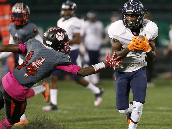Eastridge wide receiver Rayshauid Smith, right, cuts