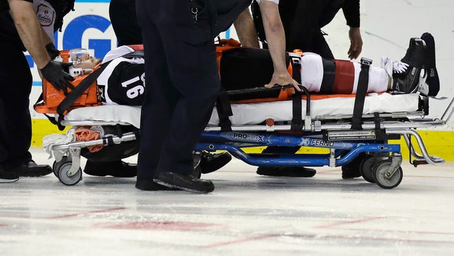 Arizona Coyotes center Alexander Burmistrov (91) is taken off the ice on a stretcher following a hit by Boston Bruins defenseman Colin Miller during the second period of an NHL hockey game in Boston, Tuesday, Feb. 28, 2017.