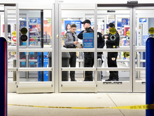 In this file photo from April 7, 2016, Pennsylvania State Police troopers gather in one entrance at the scene of a shooting at the Walmart in Shrewsbury Township.