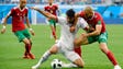 Iran forward Karim Ansari Fard challenges Morocco's
