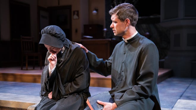 Marcus Truschinski comforts April Paul in "Doubt, a Parable," performed by Milwaukee Chamber Theatre. The show concludes its run at Broadway Theatre Center this weekend.