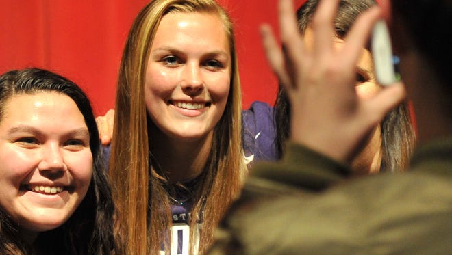 Wichita Falls High School goalkeeper Erin Smith posed for a picture with friends and classmates shortly after signing her letter of intent to play womens soccer at Abilene Christian University next season Thursday afternoon in the Old High auditorium.