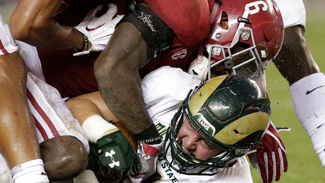 Colorado State tight end Dalton Fackrell is tackled by Alabama defensive back Hootie Jones during the first half of an NCAA college football game, Saturday, Sept. 16, 2017, in Tuscaloosa, Ala. (AP Photo/Brynn Anderson)
